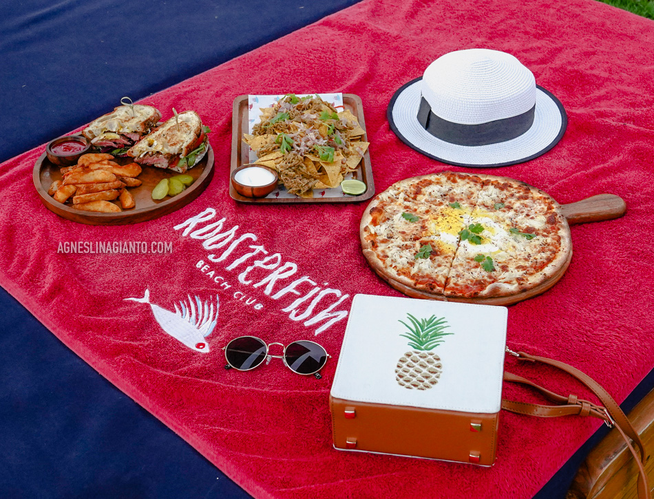 Steak sandwhich, nachos and pizza at Roosterfish Beach Club