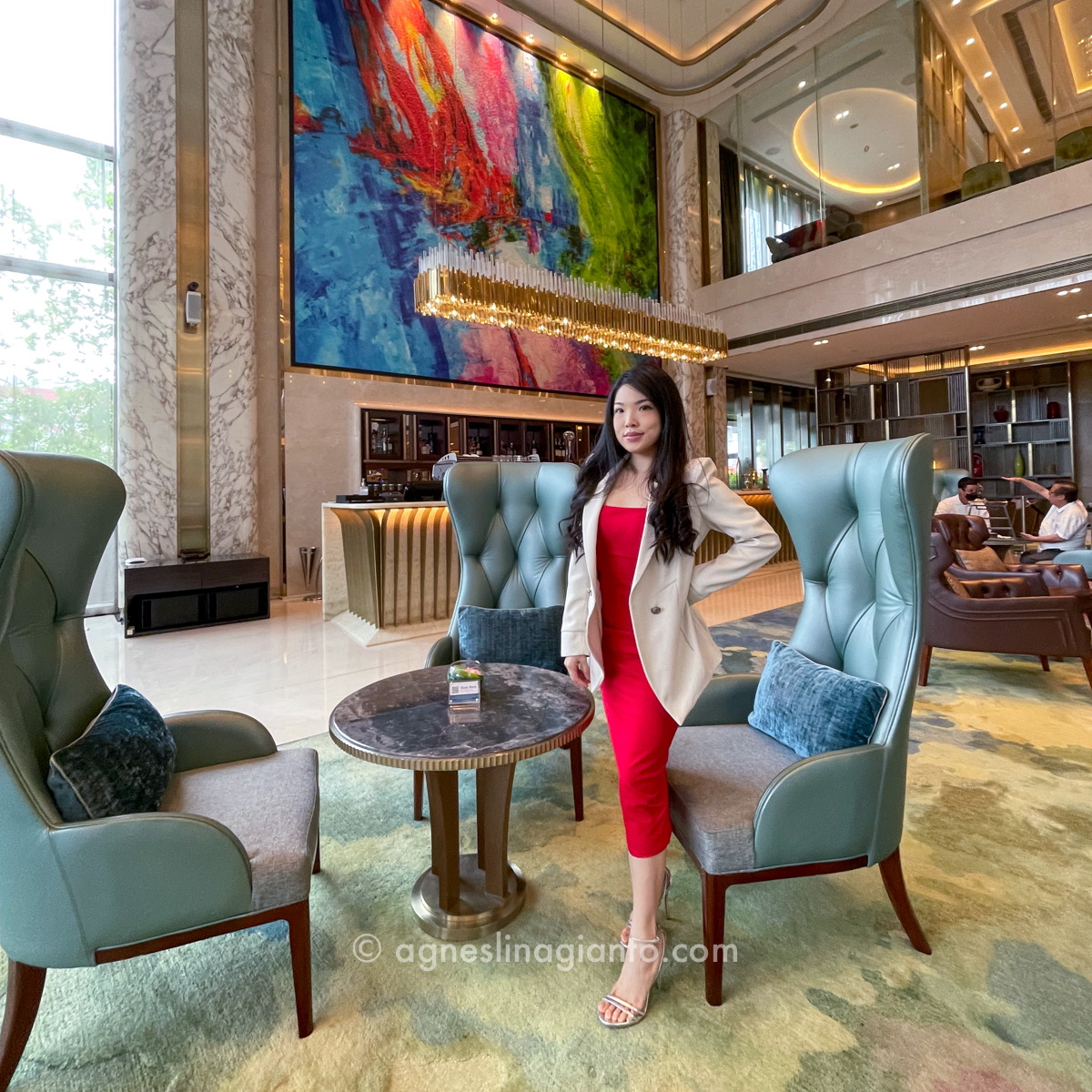 Asian business woman at 5 star luxury hotel lobby
