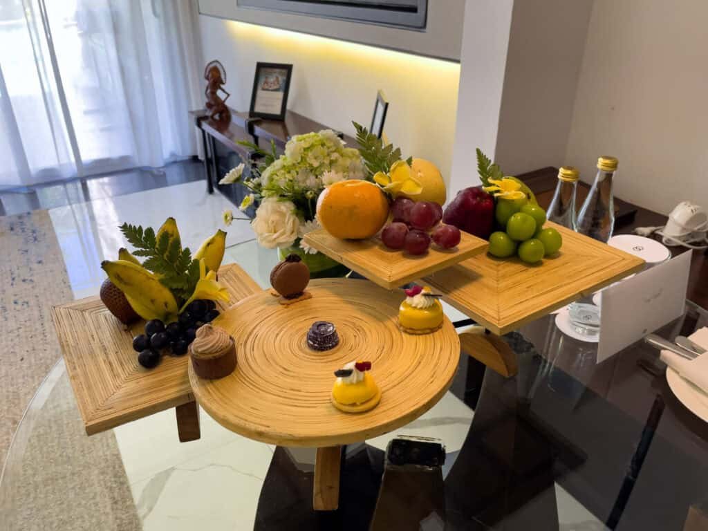 Fruit, pastries and a welcome note set out in a Luxury Room with pool access at Sofitel Bali Nusa Dua