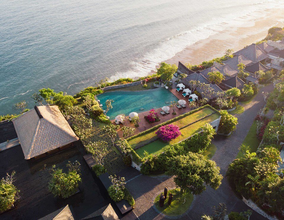 Bulgari Resort Bali from the air, its villas and pool on the clifftop above the Indian Ocean at Uluwatu