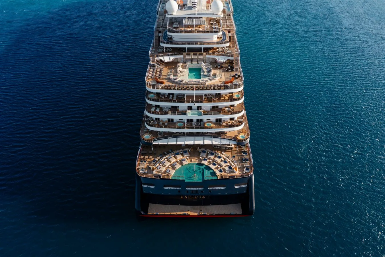 Explora Journeys EXPLORA I cruising past the Greek coastline, seen from above