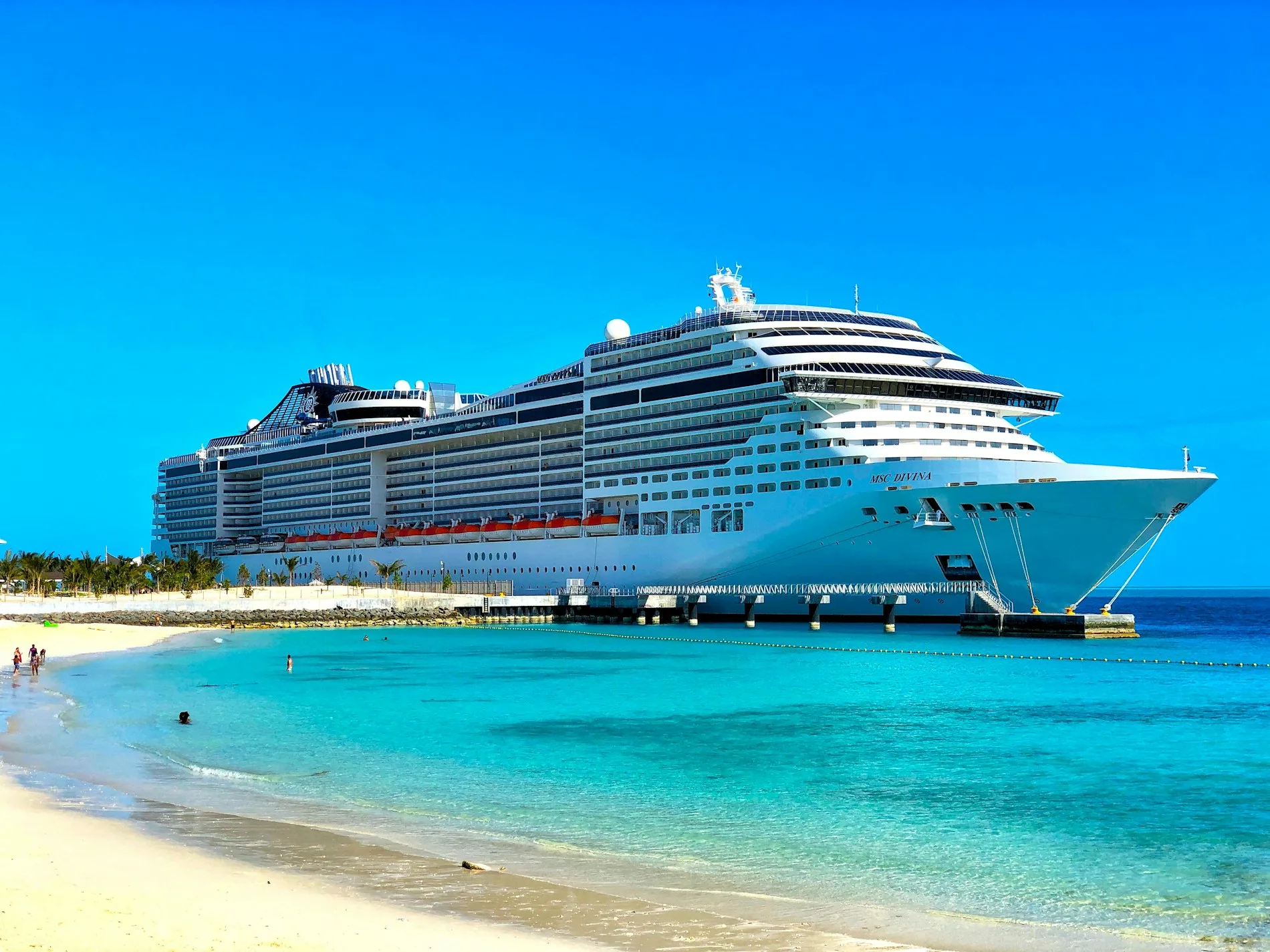 A luxury cruise ship at sea under a clear sky