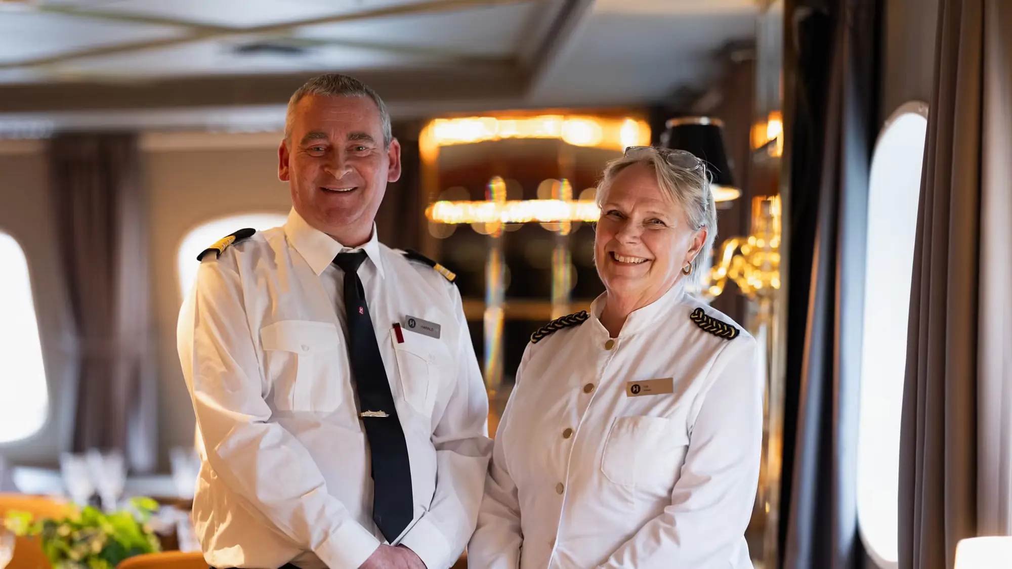 Two officers aboard MS Vesteralen after the ship's refurbishment