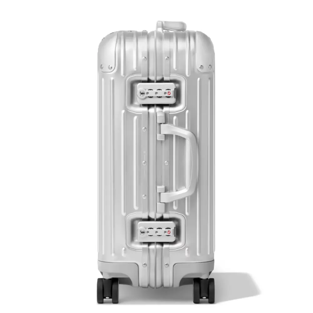 Detail of the Rimowa Original Cabin latches and grooved aluminium shell