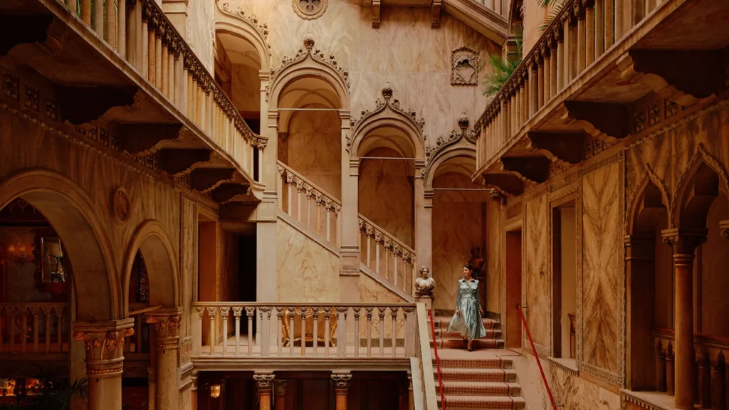 The restored grand staircase in the Palazzo Dandolo lobby at Danieli, Venezia, with Venetian Gothic arches and hand-painted gilding