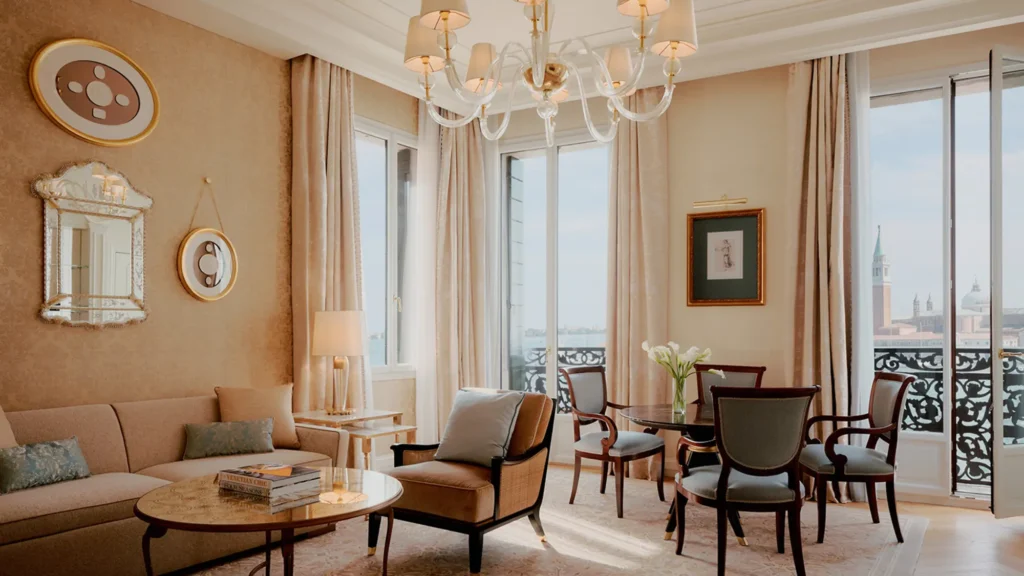 A suite living room at Danieli, Venezia looking out to the Venetian lagoon through arched windows