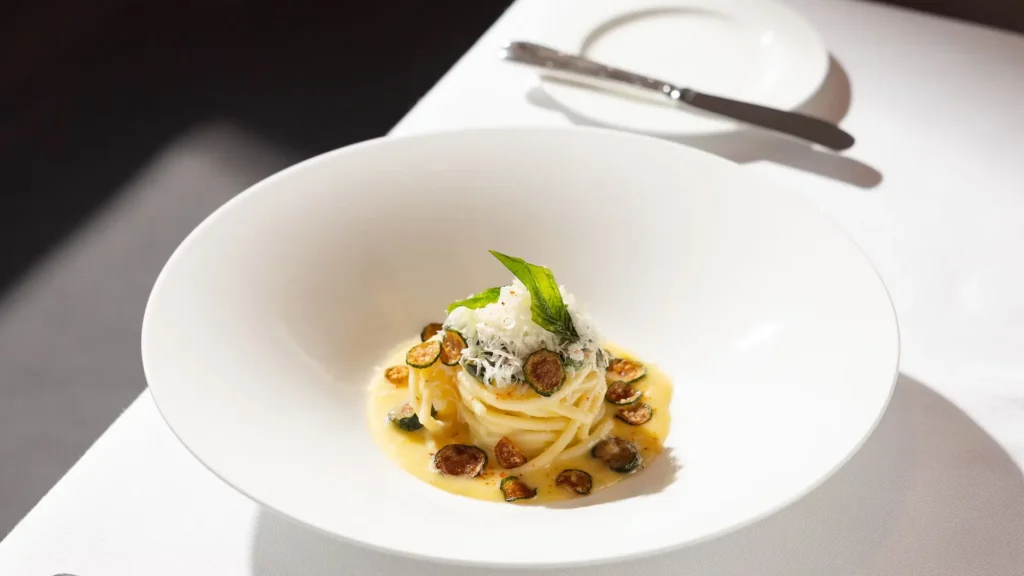 A plated pasta course served aboard EXPLORA II