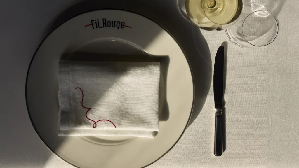 A place setting at Fil Rouge aboard EXPLORA II