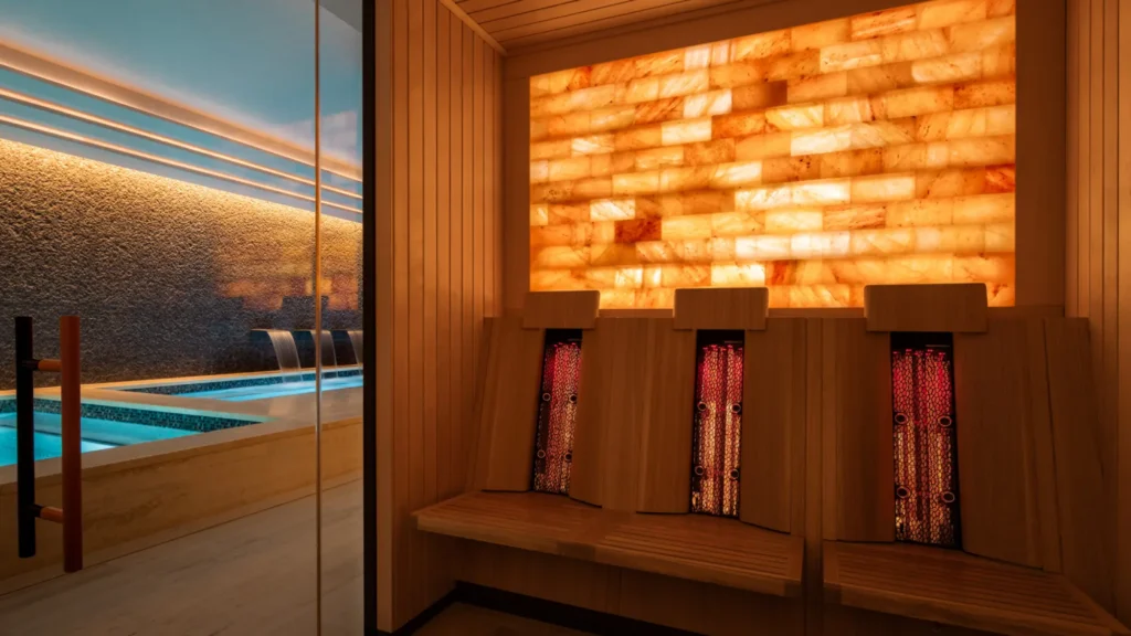 The backlit salt wall and loungers at Kai Holo Spa