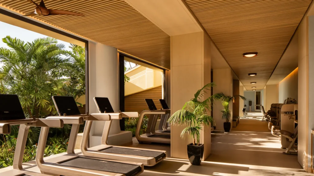 Treadmills facing the palms at the Four Seasons Maui fitness centre