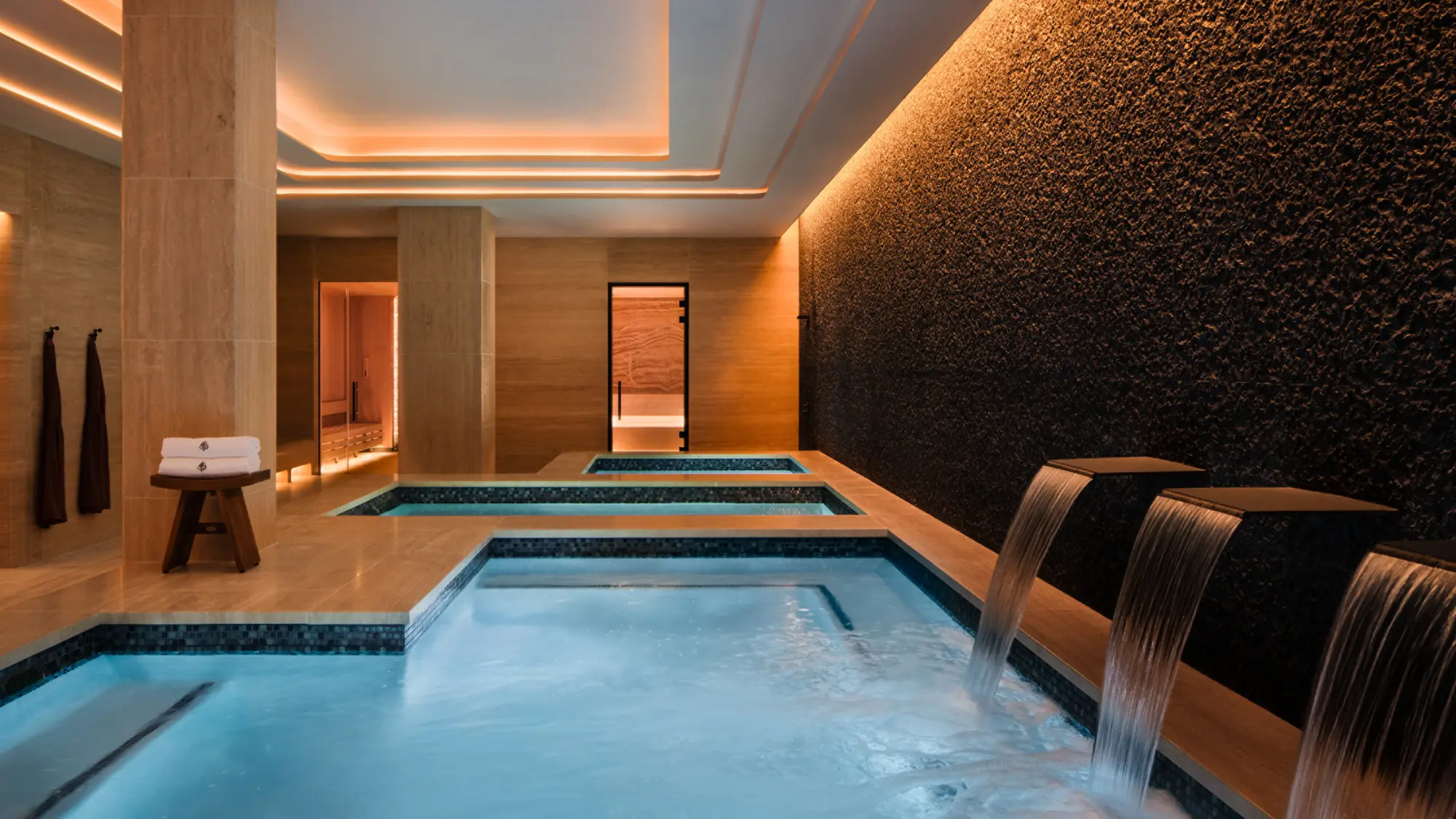 The indoor vitality pool and water spouts at Kai Holo Spa