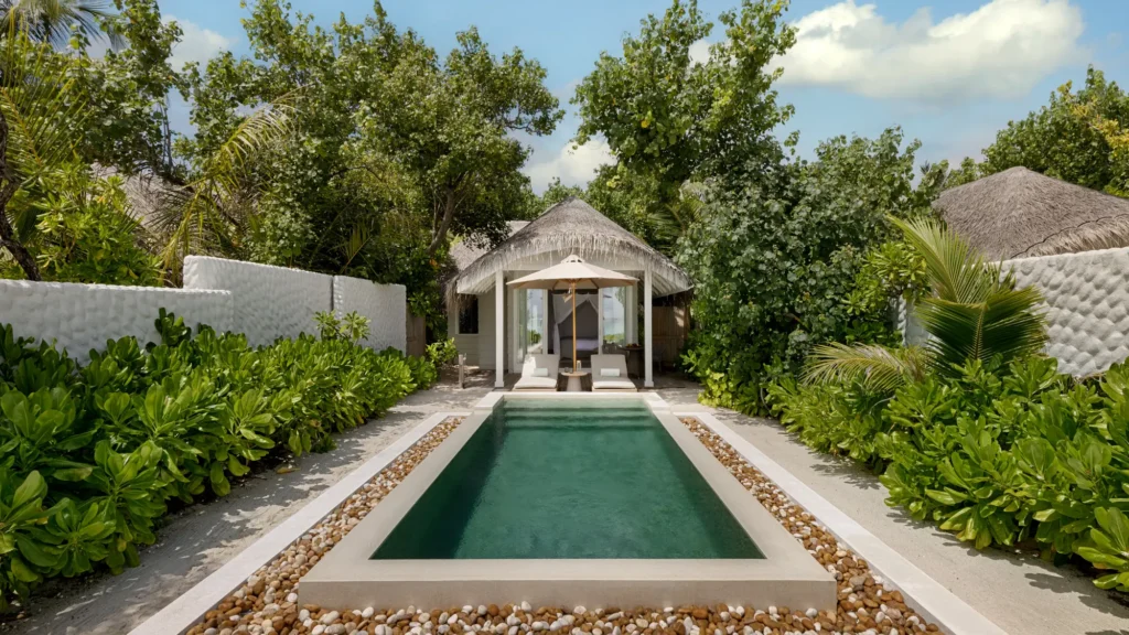 A Beach Villa with a private pool set among tropical planting at Six Senses Kanuhura, where retreat guests stay