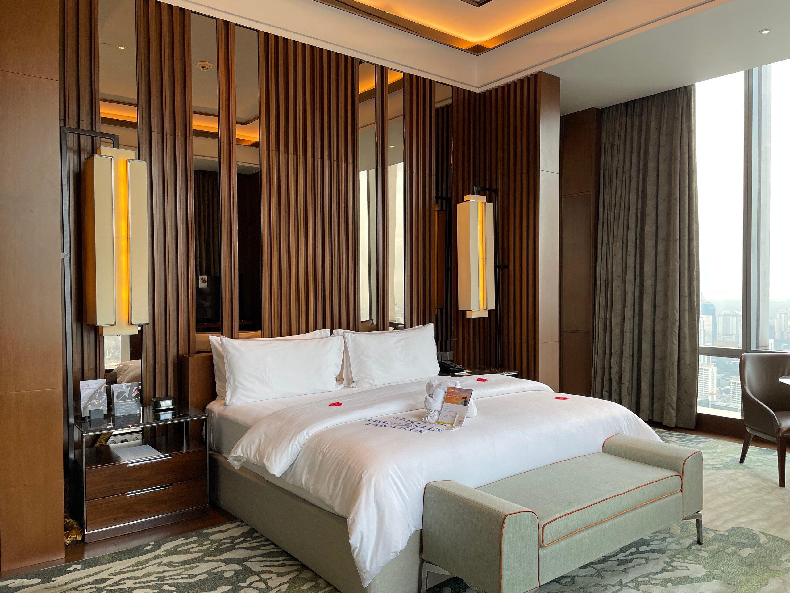 The Heavenly Bed, turned down with rose petals — The Westin Jakarta