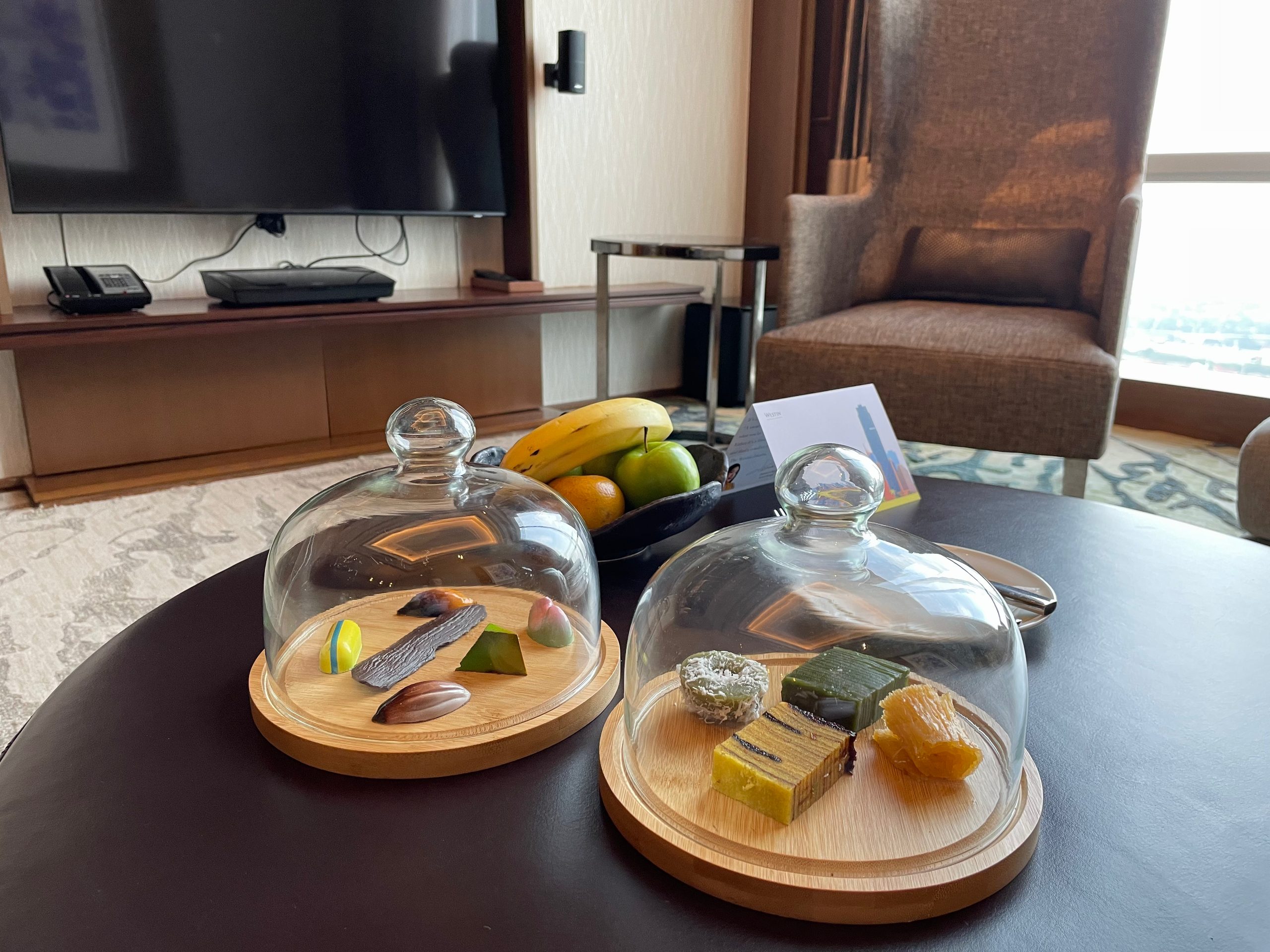 Welcome treats and fresh fruit, laid out on arrival — The Westin Jakarta