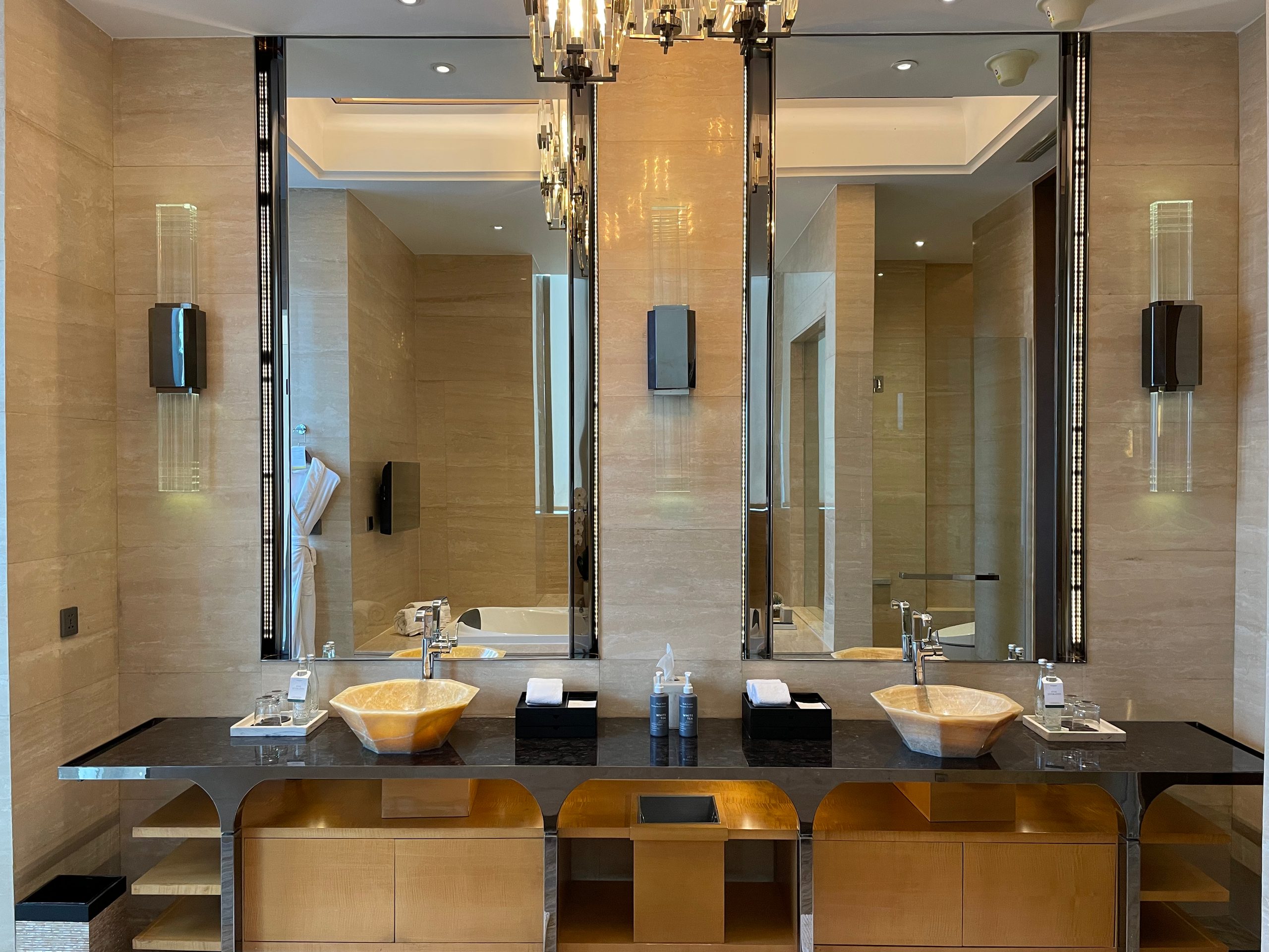 Double onyx vessel sinks on the marble counter — The Westin Jakarta