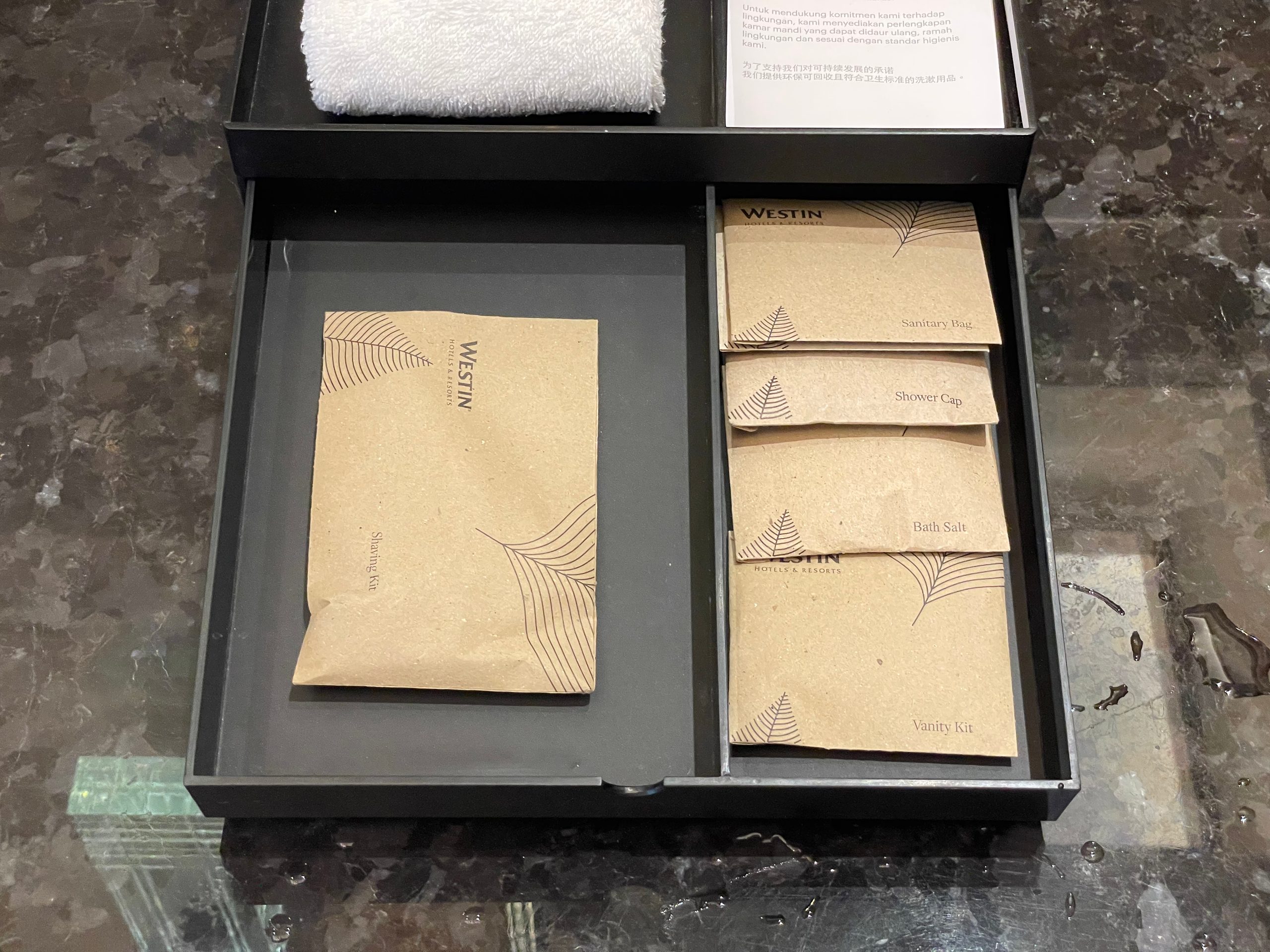 Westin-branded amenities in the vanity drawer — The Westin Jakarta