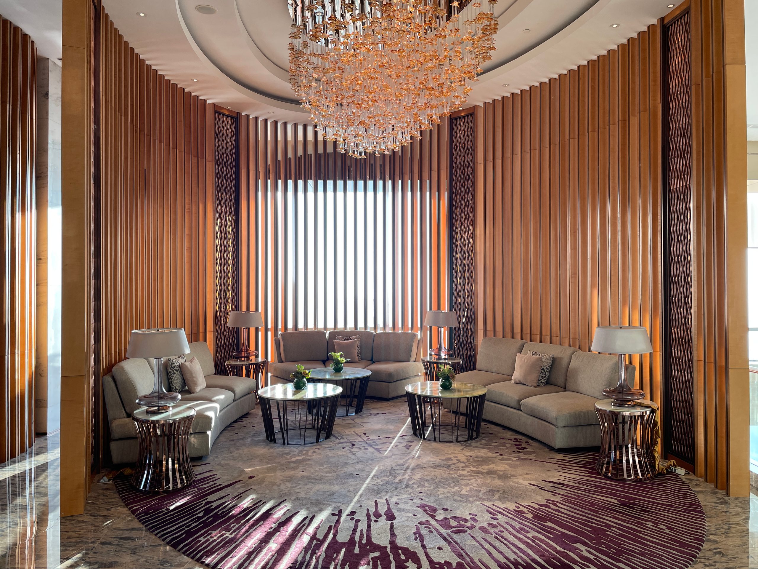 Lobby seating beneath the sculptural ceiling installation — The Westin Jakarta