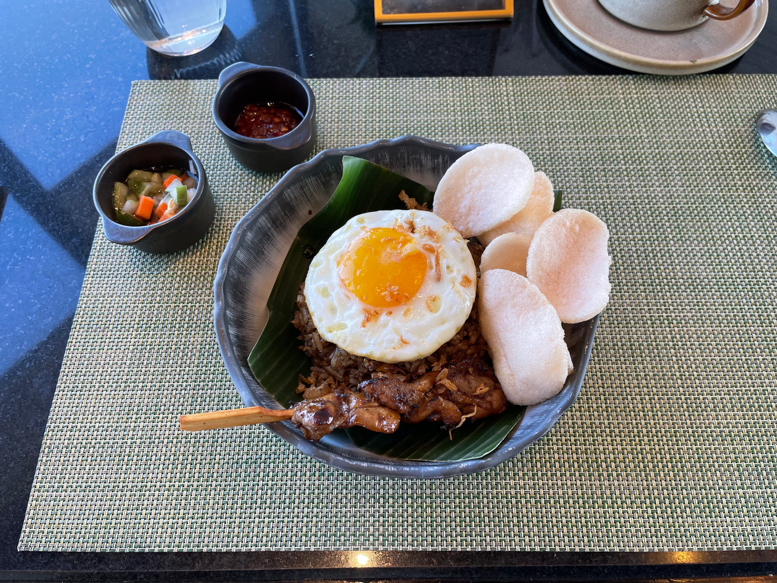 Nasi goreng kampung from the breakfast à la carte, with chicken satay, fried egg and prawn crackers — The Westin Jakarta