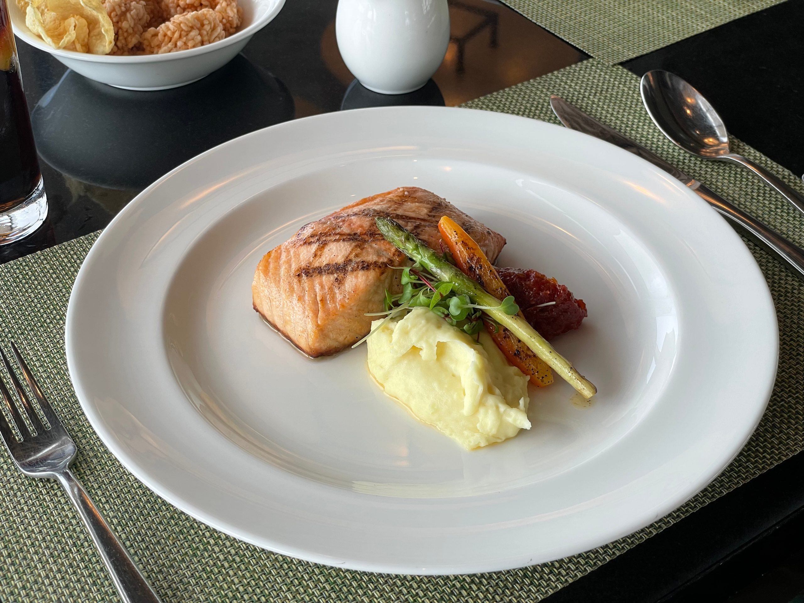 Grilled salmon at lunch, a la carte — potato puree, asparagus, charred carrot and smoked tomato jam — The Westin Jakarta