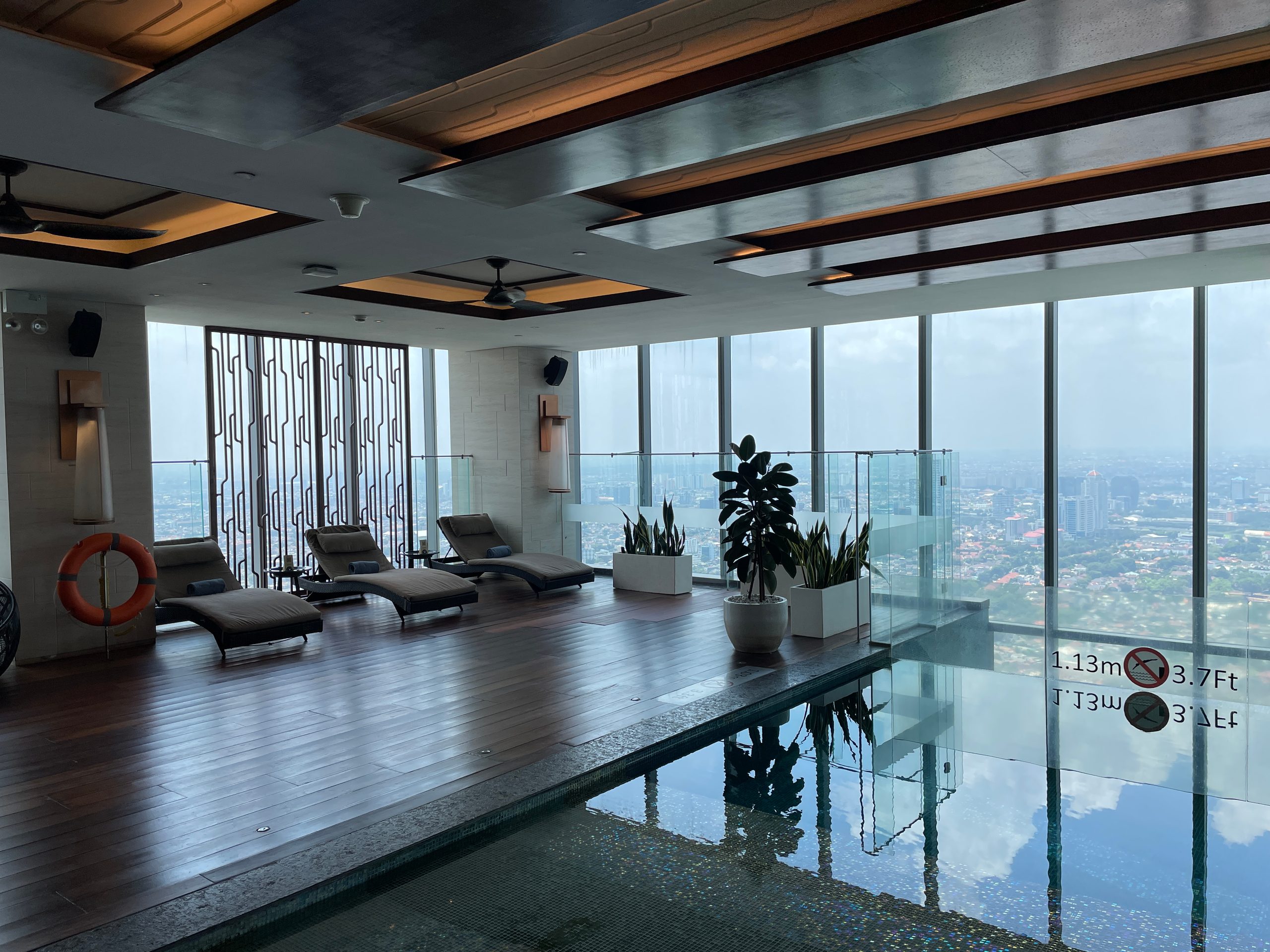 The indoor pool on level 50 at The Westin Jakarta, with city views