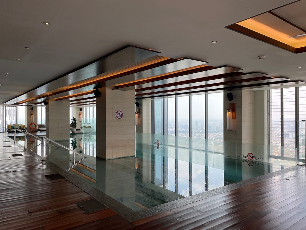 The indoor pool on level 50 at The Westin Jakarta, with city views
