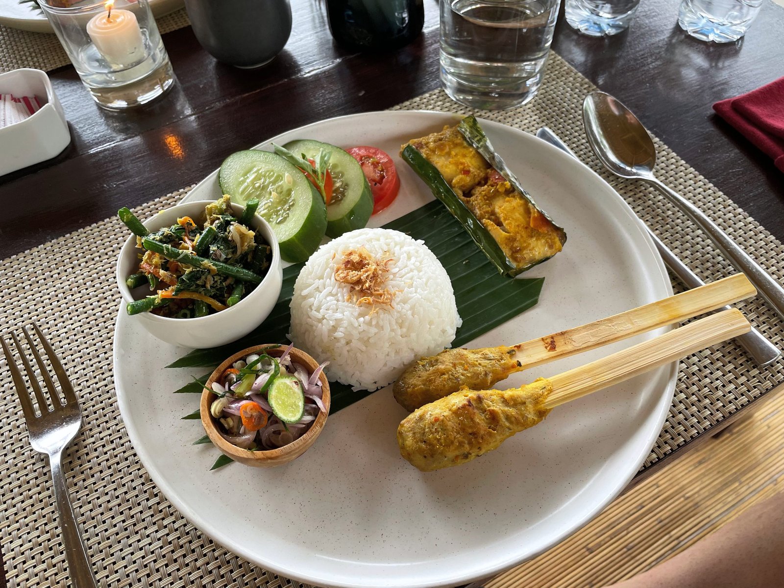 A plate of rice, sate lilit, pepes, urab and sambal matah made at the cooking class, Visesa Ubud