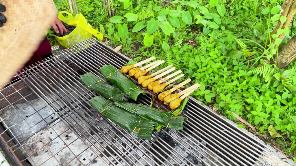 Sate lilit and pepes parcels on a charcoal grill at the cooking class, Visesa Ubud