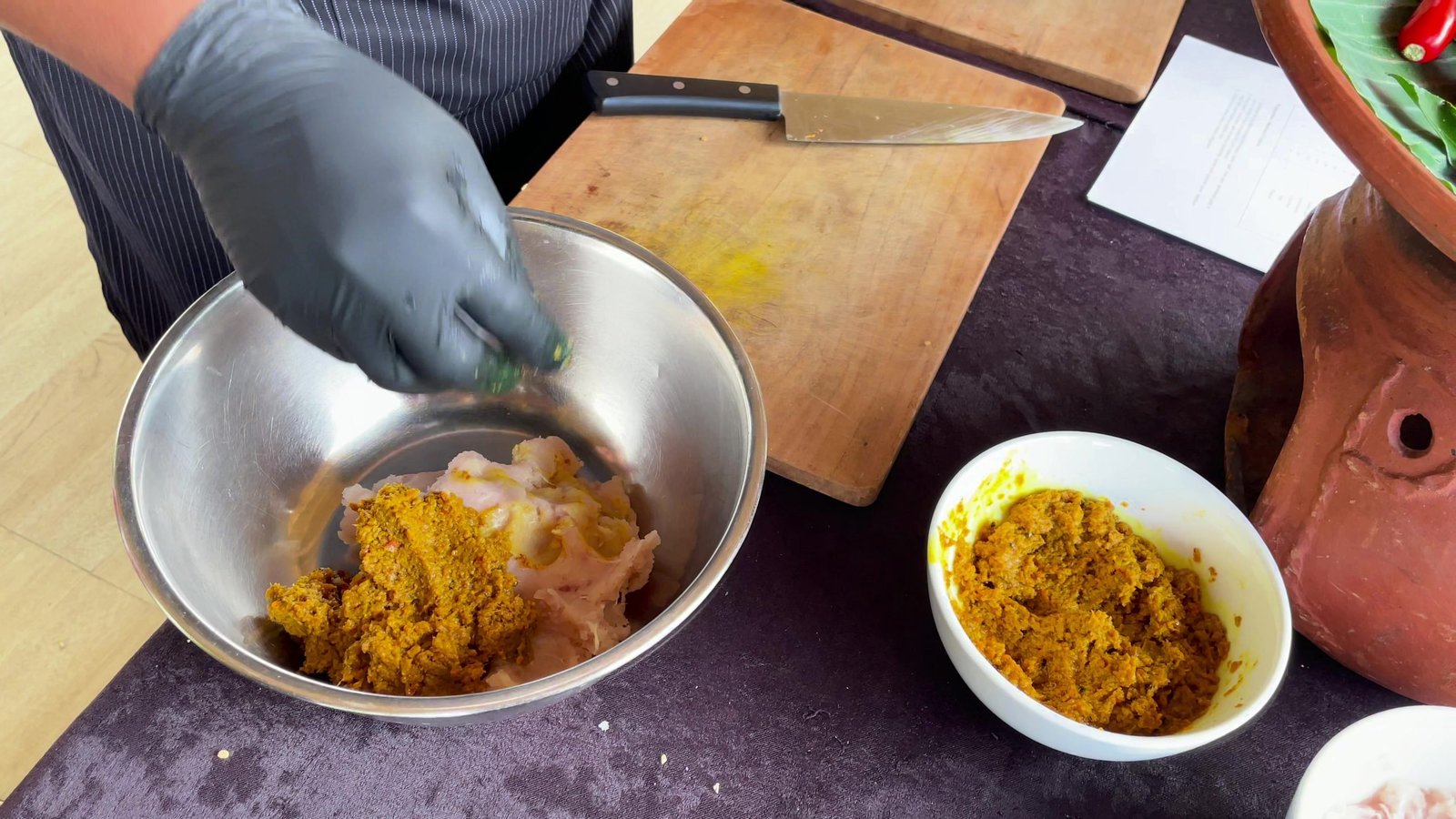 Base genep spice paste being mixed into chicken for sate lilit at the cooking class, Visesa Ubud