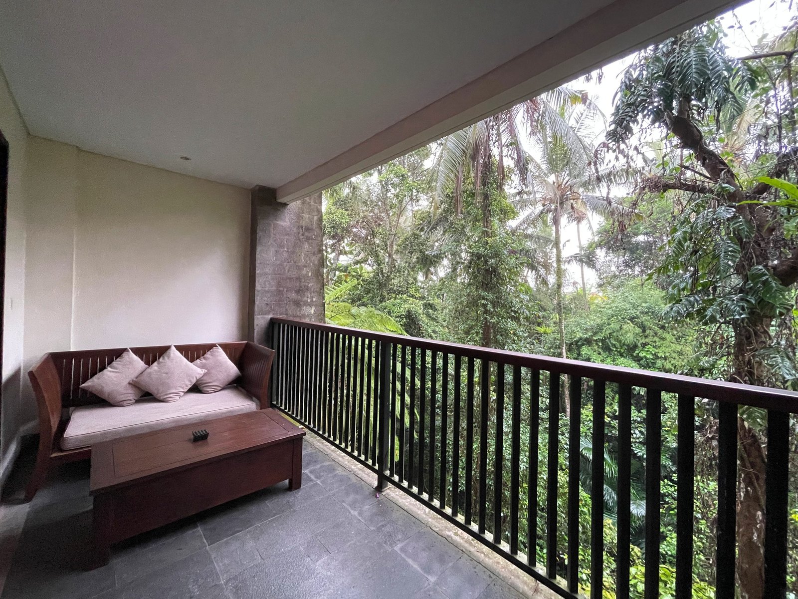The view from the Jungle Suite balcony at Visesa Ubud across the forested river valley