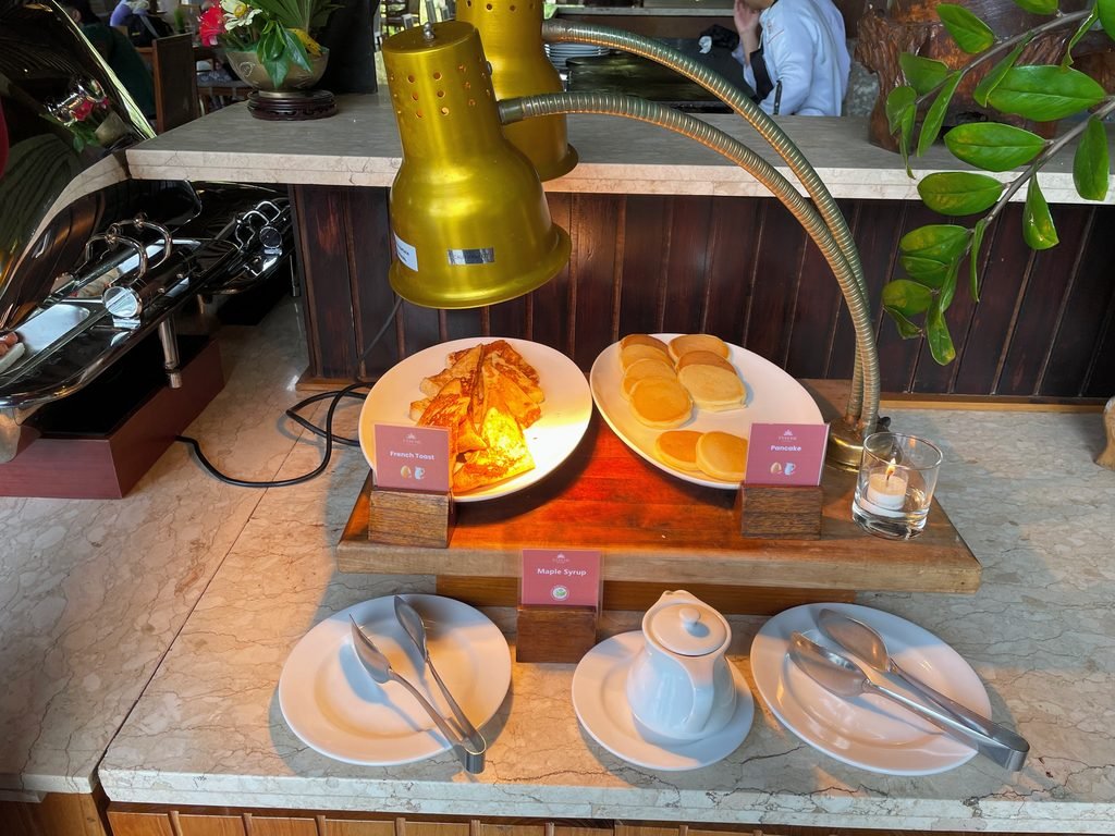 Pancakes and French toast under heat lamps at the breakfast buffet at Lesung, Visesa Ubud