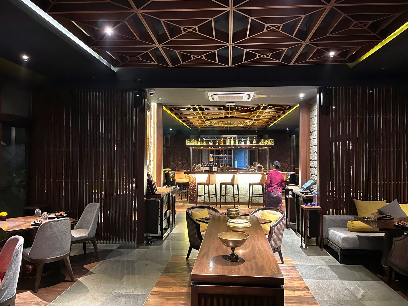The dining room of Lumbung restaurant at Visesa Ubud, with the bar at the far end