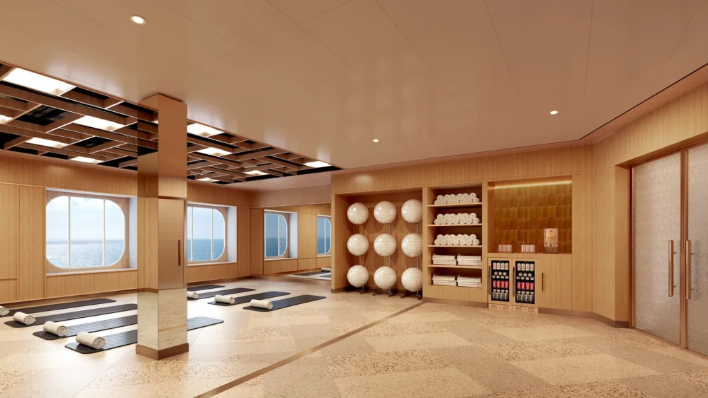 Rendering of an exercise studio with yoga mats, stability balls and towel shelving beside ocean-view windows