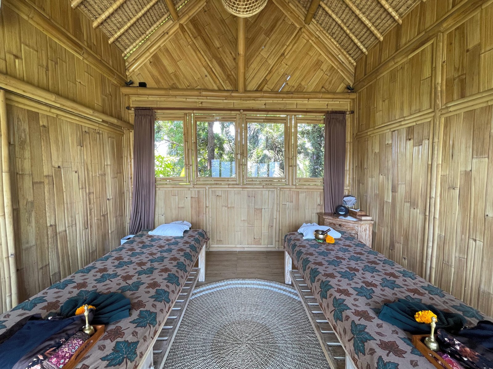 Two massage beds in the bamboo-lined couples' treatment room at Visesa Spa, Visesa Ubud