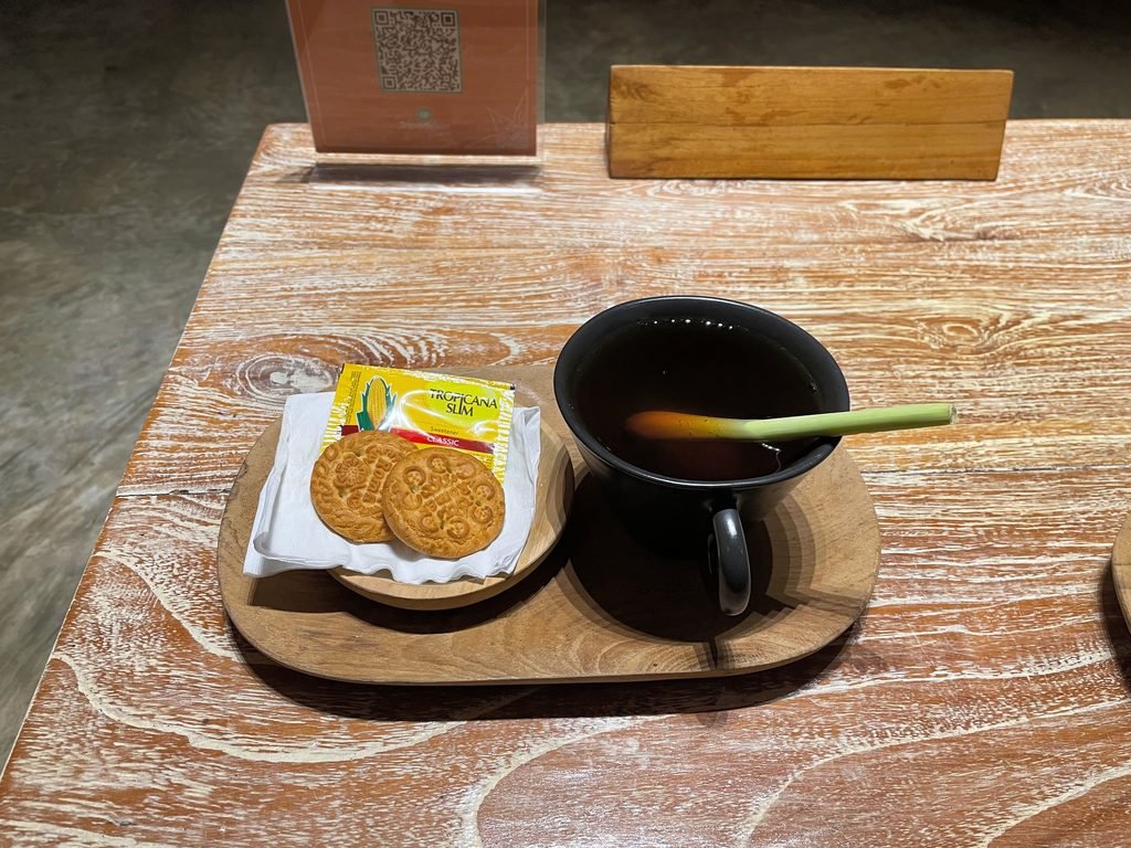 A cup of ginger tea and biscuits served after a treatment at Visesa Spa, Visesa Ubud