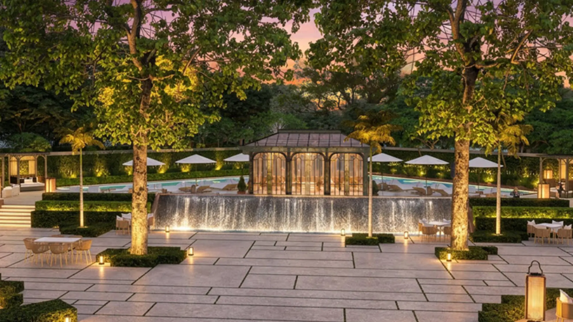 Rendering of a lit garden terrace with a cascading water feature at JW Marriott Bangkok Sathorn