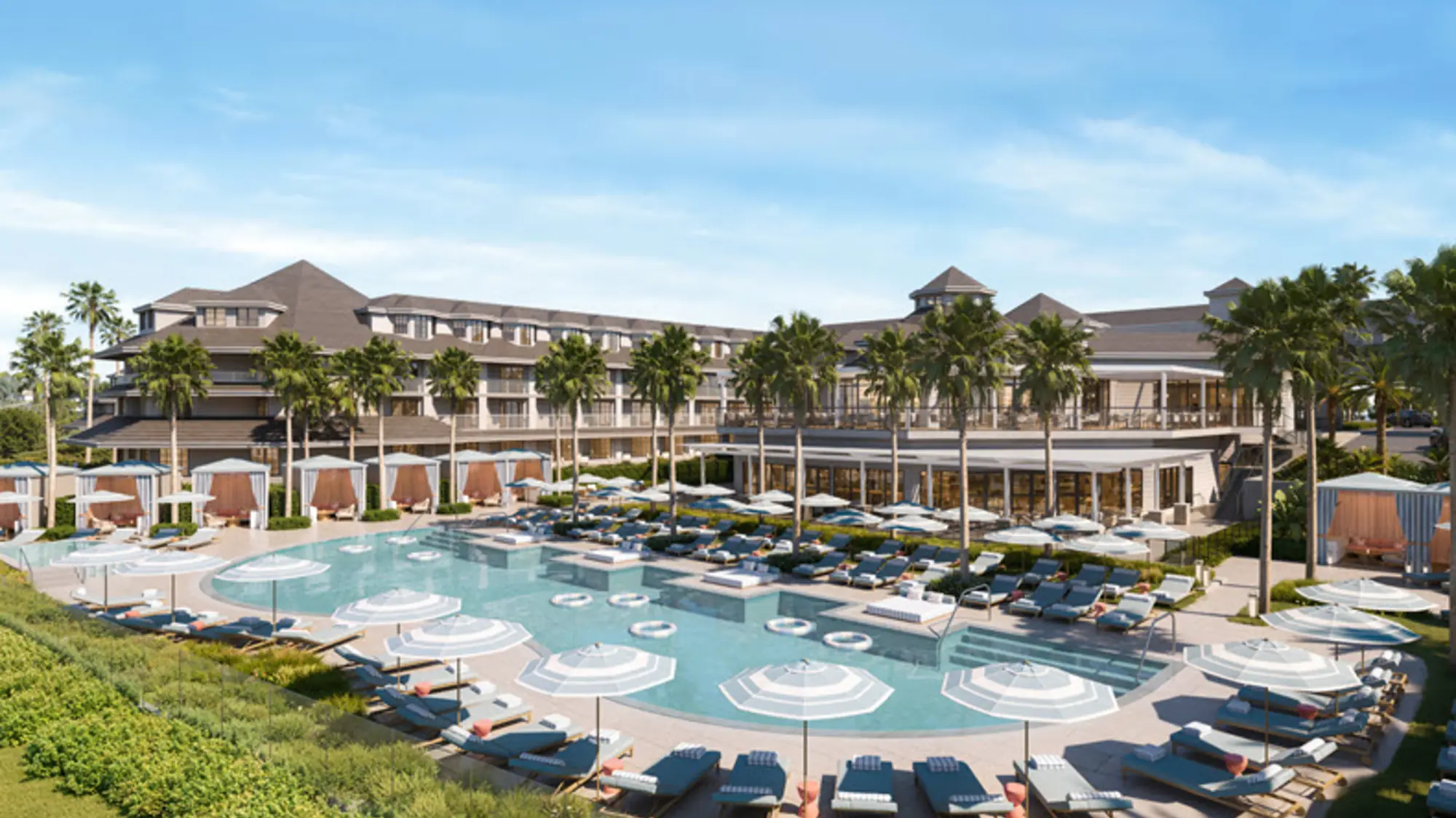 Rendering of a resort pool ringed by striped umbrellas, loungers and cabanas in front of a low shingle-roofed hotel