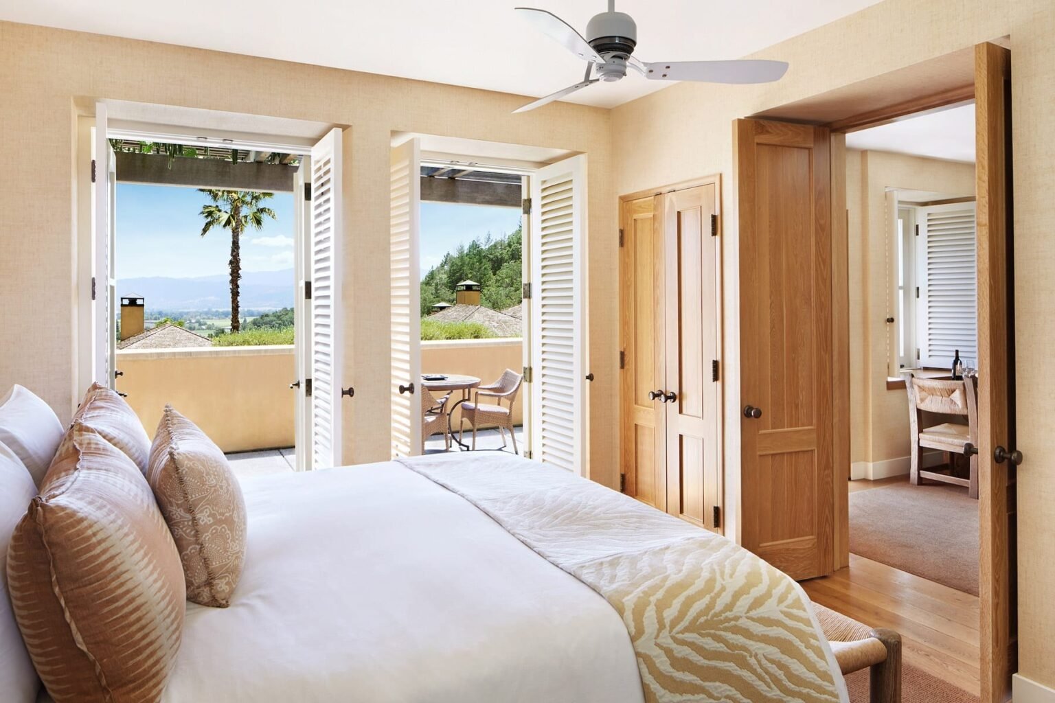Suite bedroom at Auberge du Soleil opening onto a valley-view terrace