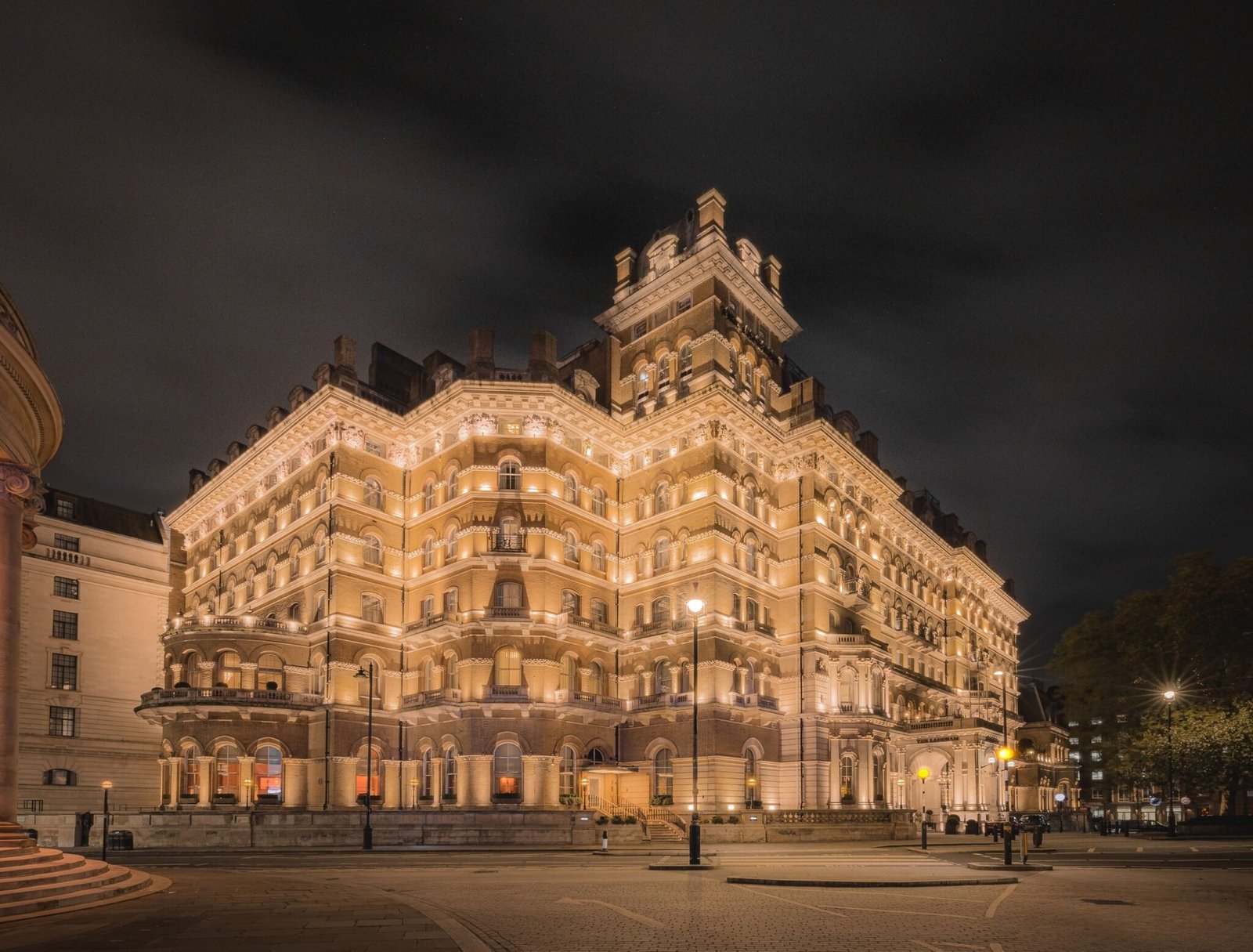 The Victorian facade of The Langham, London, floodlit at night
