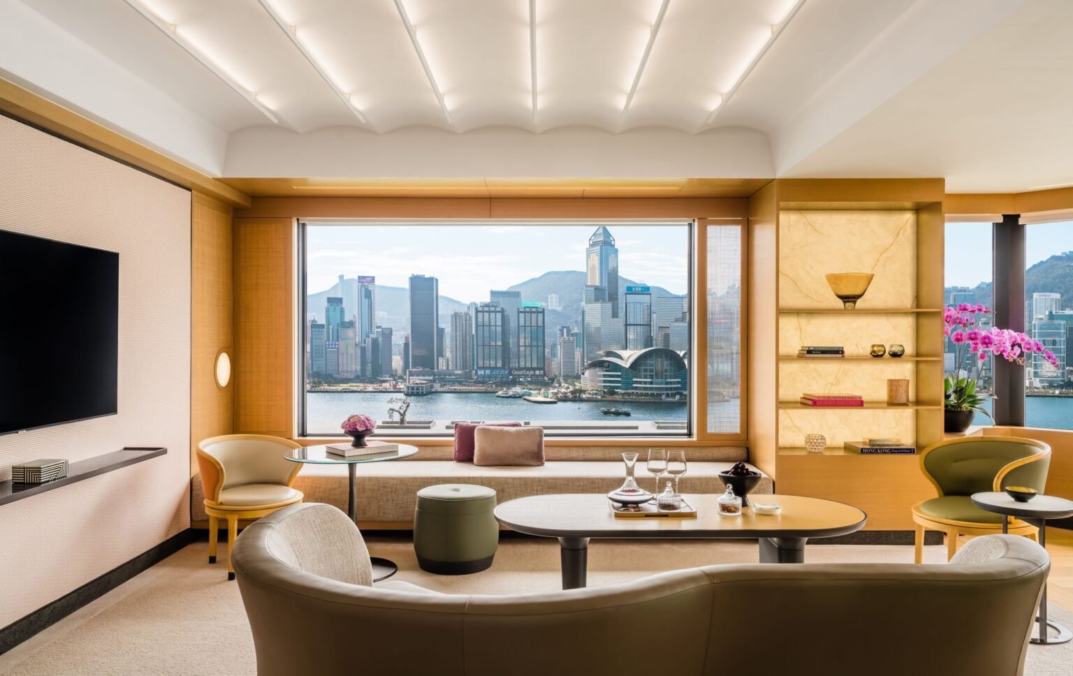 Harbour-view suite at Regent Hong Kong with the Hong Kong Island skyline through the window