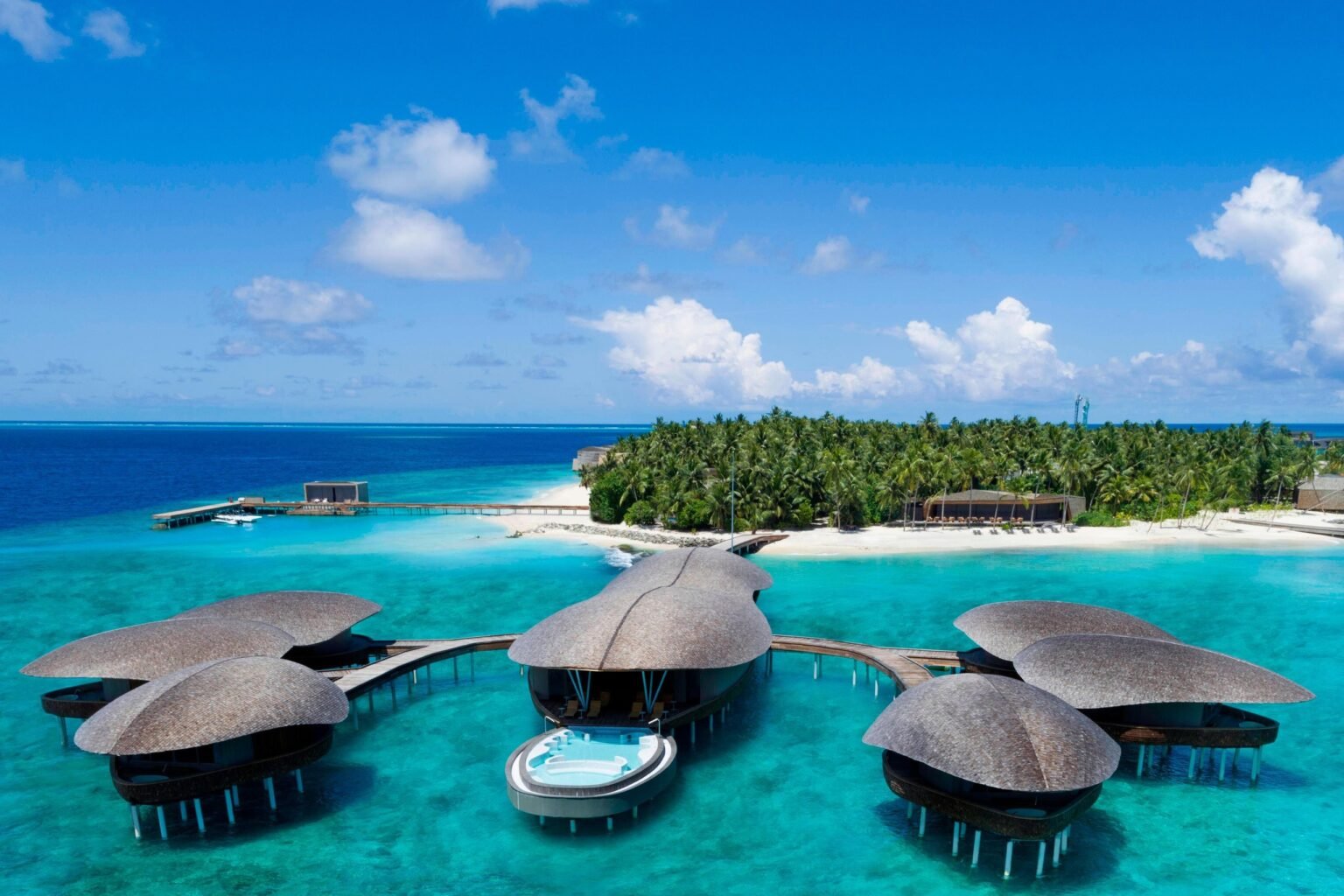 Shell-shaped overwater spa pavilions at The St. Regis Maldives Vommuli