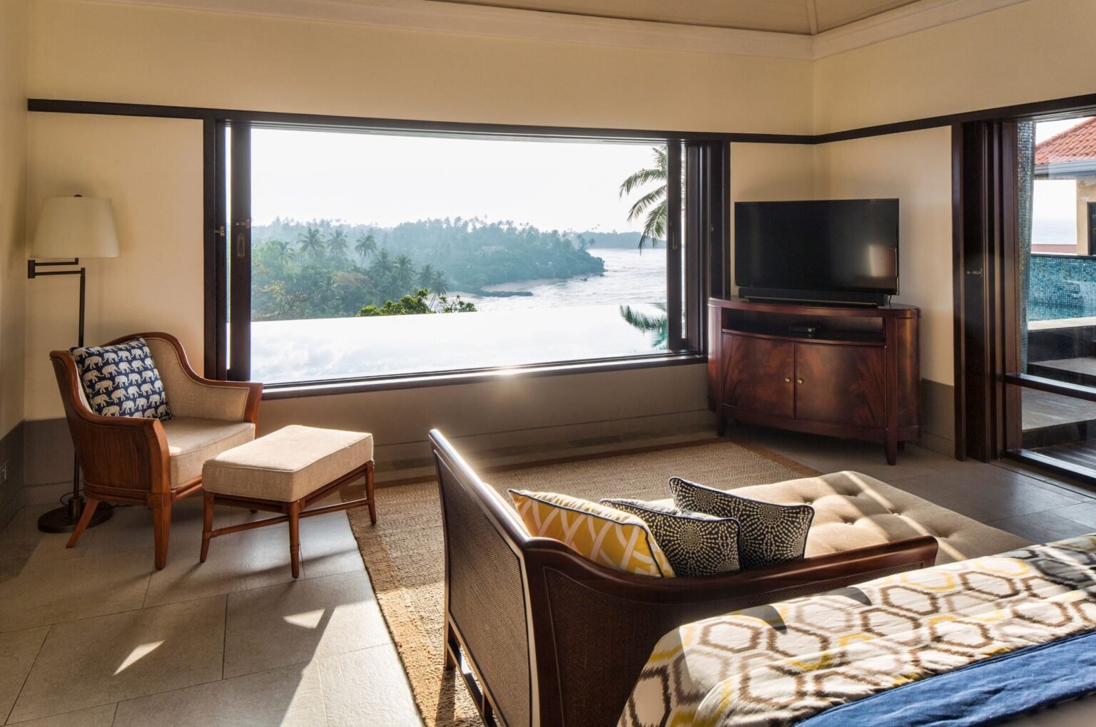 Villa bedroom at Cape Weligama with a picture window onto the bay