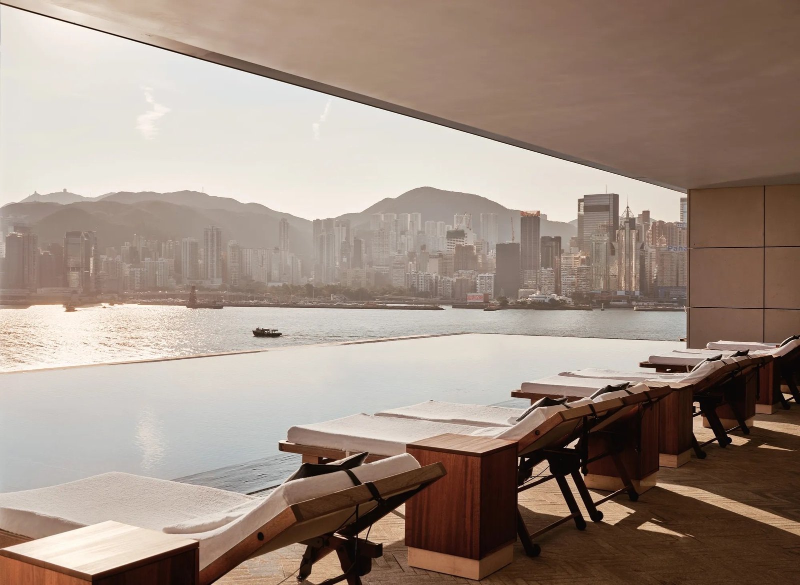 The Asaya infinity pool at Rosewood Hong Kong, looking across Victoria Harbour