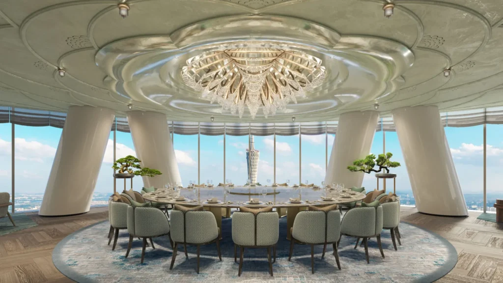 Large round private dining table beneath a crystal ceiling light, with Canton Tower visible through the windows